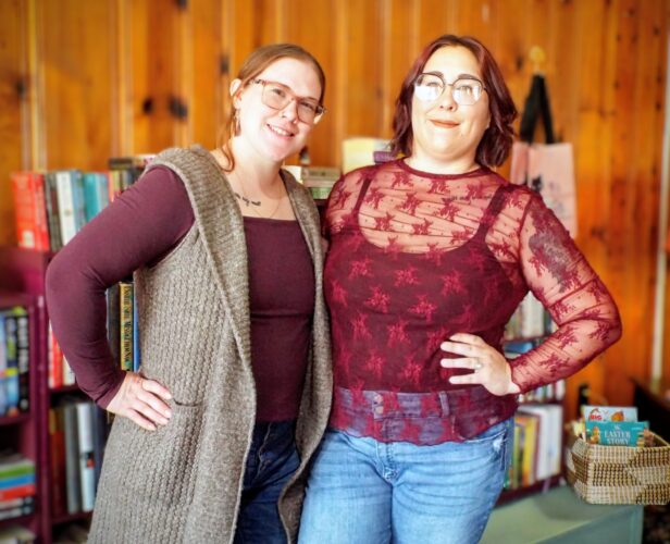 Friends sharing passion for books opening The Literary Escape